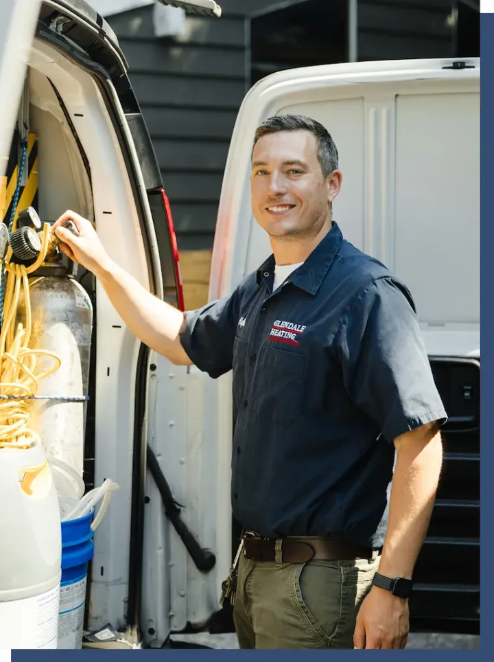 Glendale technician loading equipment from a Glendale service van